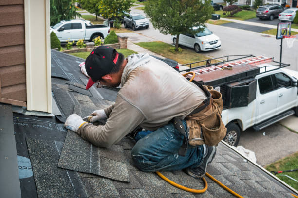 Professional Roofing technician working in Saint James, NY